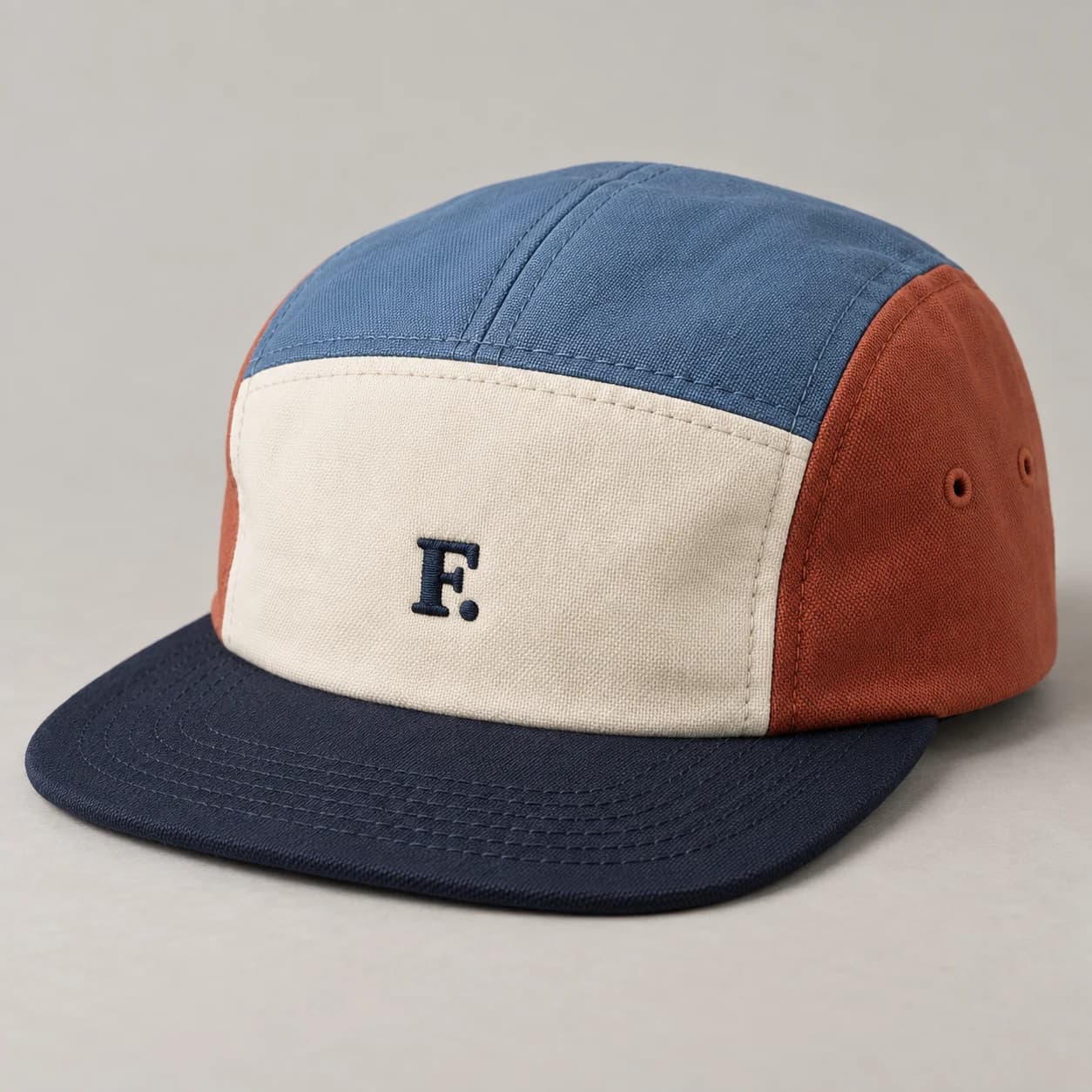 AI-generated color-block camp cap design reference illustrating panel-led camp profile